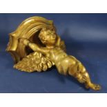 Carved gilt wood and gesso bracket in the form of a winged cherub, 32cm high