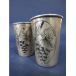Pair of hallmarked Russian silver shot beakers with enamelled grape and leaf decoration, gilt