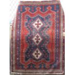 Antique Persian Hamadan three medallion rug with white medallions upon a blue and red ground, 210
