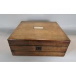 19th century rosewood writing slope of small proportions, the hinged lid enclosing an ebonised
