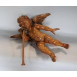 Possibly Italian carved soft wood figure of an angel blowing a horn, 35cm high