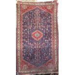 A good tight weave Afghan type rug with various still life's of animals and foliage upon a blue
