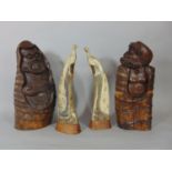 Pair of Japanese bamboo carvings of male characters and a pair of carved cattle horn ornaments of