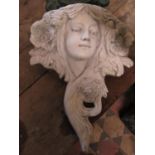 A reclaimed garden wall pocket in the form of an Art nouveau style maidens head with flowing hair 40