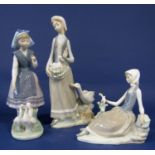 A collection of three Lladro Daisa figure groups of a goose girl, a girl pursuing white ducks and