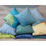 9 contemporary cushions, all with silk covers and feather pads, in shades of blue, green and