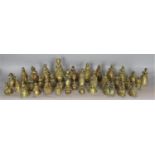 A collection of approx 40 cast brass novelty hand bells in the form of ladies in period dress, the