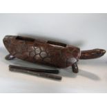 Primitive carved wooden musical percussion instrument in the form of a long tortoise, 47cm long
