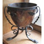 Copper jardinière upon a worked wrought iron stand in the Art Nouveau manner, 42cm high, the pot