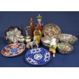 A collection of mainly reproduction oriental ceramics including four Cantonese style bowls, a figure