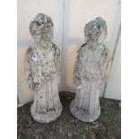 A pair of reclaimed garden figures, Chinese characters in full length robes, 62 cm in height