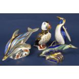 A collection of four Royal Crown Derby paperweights comprising a Lyme Bay baby dolphin (limited