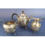 Late Victorian silver three piece bullet bachelor tea service comprising tea pot with acanthus