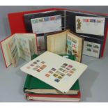 Four albums containing a worldwide selection of stamps George VI - EII period, stockbook, further