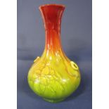 An early 20th century Bretby pottery vase with moulded simulated ring handles and oriental style