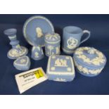 A quantity of Wedgwood blue ground jasperware decorative items including playing card suit