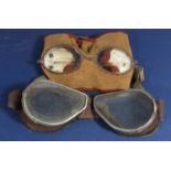 Two pairs of early aviation goggles with camel skin