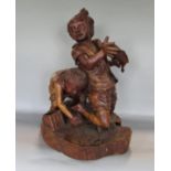 Possibly Italian carved softwood figure of two boys catching fish, 50cm high