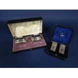 Cased pair of Walker & Hall silver salts, with blue glass liners, the case 19 cm long; together with