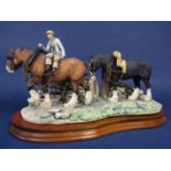 A Border Fine Arts group from the James Herriot series - Coming Home, raised on a shaped wooden