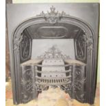 A 19th century cast iron fire insert with scrolling acanthus relief, shallow bowfronted basket and