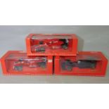 3 boxed Formula One 1:18 scale boxed model racing cars from the Michael Schumacher Collection by