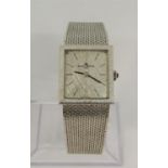 Ladies Baume & Mercier 18ct gold dress watch, the square silvered dial with baton markers with gem
