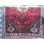 A good Persian Lori type carpet with still life's of animals and foliage and three medallions,