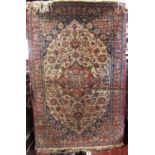 A good quality Persian Tabriz rug with central red floral medallion framed by scrolled foliage