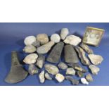 A collection of early hand tools to include pieces of flint, rock and stone