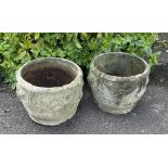 Four reclaimed circular planters with classical raised relief grape, vine and scroll detail,