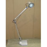 A floorstanding anglepoise lamp with chrome finish