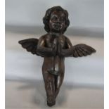 Possibly Italian carved stained softwood figure of an angel with praying hands, 46cm long