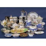 An interesting collection of 19th century and later ceramics including a large continental tin