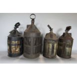 A collection of four similar conical lanterns, three with vellum type panels and grill frontage, the