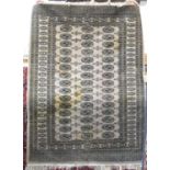 Bokhara rug with typical geometric decoration upon a washed ground, 180 x 130 cm