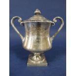 Good quality twin handled baluster pedestal trophy with lid mounted by an acorn, inscribed '1913,