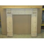 A reclaimed stripped pine fire surround with shaped corbels, the mantel 134cm wide x 116cm high, the
