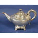 Victorian silver bullet type teapot with cast flower mount and rococo type feet, maker Frederick