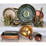 A box containing a collection of brass and copper ware to include various copper trays, a faceted