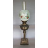 Early 20th century brass Corinthian column oil lamp, the glass shade hand painted with love birds or