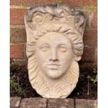 A reclaimed garden wall pocket female face mask with plaited hair and shell detail, 36 cm high x