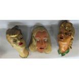 A collection of wall plaques to include to 3 plaster pin-ups in the manner of Goldscheider, futher