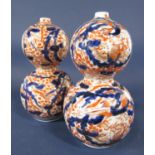 A pair of late 19th century Imari vases of double gourd shaped form, 26 cm tall approximately