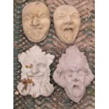 Four wall plaques, a green man, a similar pair of grotesque masks and a further whimsical