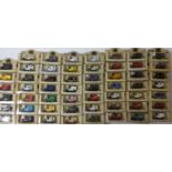 Collection of 55 die-cast models of Ford Model T vans by Lledo, most of them advertising British