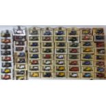 65 boxed model vehicles by Lledo, mostly Ford Model T vans, mainly advertising British Newspapers