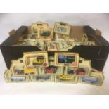 A large collection of approx 80 boxed model vehicles by Lledo including cars, coaches, tankers,