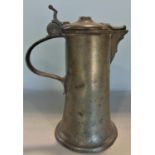 A good antique pewter lidded jug with heart shaped lip to the spout, 25cm high