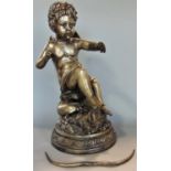 Silvered cast metal study of a seated cupid, 33 cm high